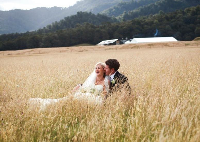 Adam and Anna in long grass at Stables 2